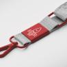 Suporte para telemóvel em forma de cruz feito de fita tecida com placa de metal (Produção)